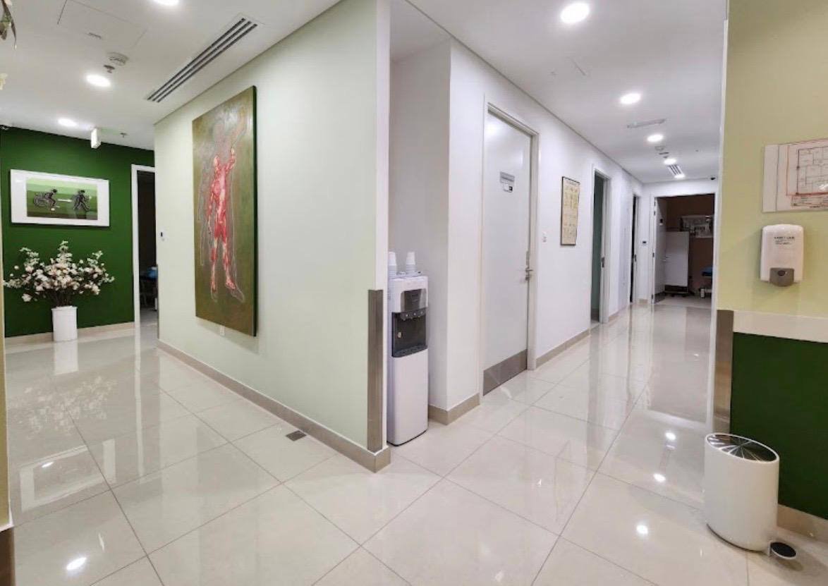 Physiocare clinic hallway with anatomy mural