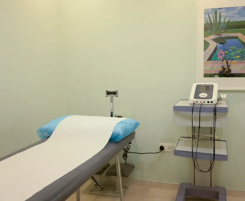 Ultrasound therapy treatment room at Physio Care Dubai with examination bed and therapeutic ultrasound machine